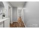 Long hallway offers plenty of light and provides access to bedrooms and other areas of the home at 1410 Swaying Branch Ln, Clover, SC 29710