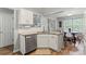 Eat-in kitchen with granite countertops, stainless steel dishwasher and open floor plan to dining area at 1410 Swaying Branch Ln, Clover, SC 29710