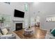 Bright living room boasts soaring ceilings, a fireplace, and hardwood floors at 1410 Swaying Branch Ln, Clover, SC 29710