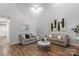 Bright living room boasts soaring ceilings, a fireplace, and hardwood floors at 1410 Swaying Branch Ln, Clover, SC 29710
