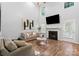 Bright living room boasts soaring ceilings, a fireplace, and hardwood floors at 1410 Swaying Branch Ln, Clover, SC 29710