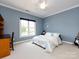 Bright bedroom with a bed, desk, and large window overlooking the outdoors at 1509 Churchill Downs Dr, Waxhaw, NC 28173