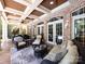 Relaxing covered patio with comfortable seating and stylish decor at 1509 Churchill Downs Dr, Waxhaw, NC 28173