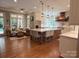 Open-concept kitchen with a large center island, stainless steel appliances, and seamless flow to the living area at 1509 Churchill Downs Dr, Waxhaw, NC 28173