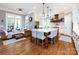 Expansive eat-in kitchen features a large island with seating, stainless appliances and white cabinetry at 1509 Churchill Downs Dr, Waxhaw, NC 28173