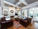 Inviting living room featuring a cozy fireplace, built-in shelves, and an abundance of natural light at 1509 Churchill Downs Dr, Waxhaw, NC 28173