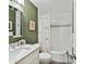 Stylish full bathroom features patterned wallpaper, tile shower, and elegant vanity at 1638 Wensley Dr, Charlotte, NC 28210