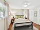 Well-lit bedroom featuring hardwood floors, natural light, and neutral decor at 1638 Wensley Dr, Charlotte, NC 28210
