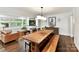 Open-concept dining room featuring hardwood floors and lots of natural light at 1638 Wensley Dr, Charlotte, NC 28210