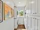 Bright laundry area features ample storage, stacked washer/dryer, and natural light at 1638 Wensley Dr, Charlotte, NC 28210
