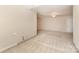 Spacious bedroom featuring neutral carpet, a ceiling fan, and a connecting door at 1750 Trellis Dr, Rock Hill, SC 29732