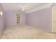 Comfortable bedroom with lilac-colored walls, neutral carpet, a window, and a ceiling fan at 1750 Trellis Dr, Rock Hill, SC 29732
