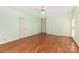 Large bedroom with hardwood floors, a ceiling fan, and three closets at 1750 Trellis Dr, Rock Hill, SC 29732