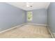 Bright bedroom with carpet, ceiling fan, and window offering a cozy and inviting space at 1750 Trellis Dr, Rock Hill, SC 29732