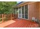 Spacious wooden deck leads to a screened-in porch, perfect for outdoor entertaining at 1750 Trellis Dr, Rock Hill, SC 29732