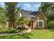 Charming single-Gathering home with brick facade, lush landscaping, and inviting front entrance in a well-maintained yard at 1750 Trellis Dr, Rock Hill, SC 29732