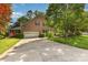 Charming brick home featuring an attached garage, driveway, and mature landscaping at 1750 Trellis Dr, Rock Hill, SC 29732