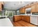 Cozy kitchen with wooden cabinets, a white refrigerator, and a sunlit breakfast nook at 1750 Trellis Dr, Rock Hill, SC 29732