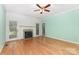 Living room with hardwood floors, fireplace, and windows to the outside at 1750 Trellis Dr, Rock Hill, SC 29732