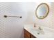 Quaint powder room featuring a classic vanity, and a gold ornate oval mirror at 1750 Trellis Dr, Rock Hill, SC 29732
