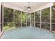 Relaxing screened-in porch with ceiling fan and views of mature trees at 1750 Trellis Dr, Rock Hill, SC 29732