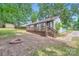 View of house from backyard with small deck and fire pit at 2009 Pinevalley Rd, Rock Hill, SC 29732