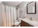 Bathroom features a shower-tub combo and vanity with a brown cabinet at 2009 Pinevalley Rd, Rock Hill, SC 29732