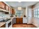 Bright kitchen featuring wood cabinets, composite countertops, and stainless steel faucet at 2009 Pinevalley Rd, Rock Hill, SC 29732