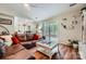 Inviting living room featuring wood floors, a comfortable sofa, and sliding doors to an outdoor deck at 2009 Pinevalley Rd, Rock Hill, SC 29732