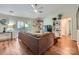Comfortable living room with stylish decor, including wood floors, a ceiling fan, and access to the deck at 2009 Pinevalley Rd, Rock Hill, SC 29732