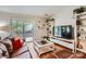 Cozy living room with wood floors, comfortable seating, and sliding glass doors leading to a deck at 2009 Pinevalley Rd, Rock Hill, SC 29732