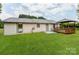 Backyard featuring a well-maintained lawn, cozy gazebo, and accessible patio area at 2040 Stratford Dr, Conover, NC 28613