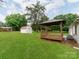 Large, green backyard with gazebo and shed providing ample outdoor space at 2040 Stratford Dr, Conover, NC 28613