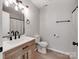 Cozy bathroom featuring a wood vanity, a toilet and a shower with a curtain at 2040 Stratford Dr, Conover, NC 28613