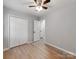 Bedroom featuring hardwood flooring, closet with bi-fold doors and overhead lighting at 2040 Stratford Dr, Conover, NC 28613