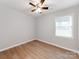 Bright bedroom with hardwood flooring, ceiling fan and a window allowing natural light at 2040 Stratford Dr, Conover, NC 28613
