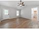 Bright bedroom featuring vaulted ceilings, wood-look floors, and ensuite bathroom at 2040 Stratford Dr, Conover, NC 28613