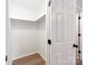 This walk-in closet features a shelf, a light and wood-look flooring at 2040 Stratford Dr, Conover, NC 28613