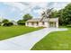 Single-story home with long driveway, attached carport, and newly painted exterior at 2040 Stratford Dr, Conover, NC 28613