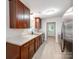 Modern kitchen with wood cabinets, stainless steel appliances, and durable countertops at 2040 Stratford Dr, Conover, NC 28613