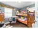 Blue colored room with a bunkbed in a bedroom featuring natural light and wooden floors at 2217 Tate St, Charlotte, NC 28216