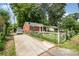 Cozy brick home with a driveway and a fenced front yard at 2217 Tate St, Charlotte, NC 28216