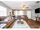 Spacious living room featuring hardwood floors and comfortable sofas at 2217 Tate St, Charlotte, NC 28216