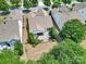 Aerial view of the backyard featuring a patio surrounded by landscaped shrubs and lawn at 2224 Hartwell Ln, Fort Mill, SC 29707