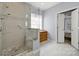 Bright bathroom showcasing a tiled walk-in shower, bench, and vanity at 2224 Hartwell Ln, Fort Mill, SC 29707
