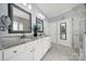 The primary bathroom features a double vanity, and tiled flooring creating a spa-like experience within the comfort of home at 2224 Hartwell Ln, Fort Mill, SC 29707