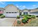 Inviting single-Gathering home with an attached garage, neat landscaping, and a paved driveway at 2224 Hartwell Ln, Fort Mill, SC 29707