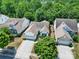 Aerial view of a single-Gathering home showcasing well-maintained landscaping and a driveway leading to the garage at 2224 Hartwell Ln, Fort Mill, SC 29707