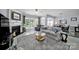 Bright living room featuring fireplace, large windows, and a comfortable seating area, perfect for relaxation and entertaining at 2224 Hartwell Ln, Fort Mill, SC 29707