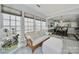 Sunlit seating area offers serene views with access to the dining and kitchen area making it ideal for enjoying your morning coffee at 2224 Hartwell Ln, Fort Mill, SC 29707